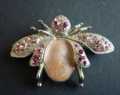 BROOCH WINGED BEETLE RED/PINK STONES ON SILVER TONED DESIGN